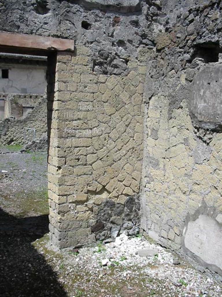 IV.6, Herculaneum, May 2003. Room 11, north west corner, looking through doorway across rear atrium.
Photo courtesy of Nicolas Monteix.